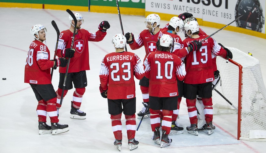 epa09231487 Swiss players celebrate after winning the IIHF Ice Hockey World Championship 2021 group A match between Switzerland and Slovakia at the Olympic Sports Centre in Riga, Latvia, 27 May 2021.  ...