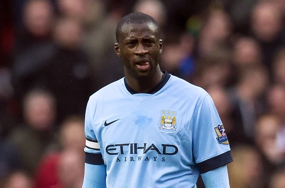 FILE - In this Sunday, April 12, 2015 file photo, Manchester City&#039;s Yaya Toure waits for play to resume during the English Premier League soccer match between Manchester United and Manchester Cit ...