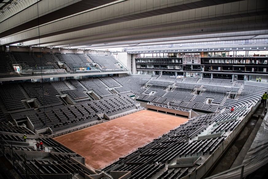The construction work of the newly built roof of the Philippe Chatrier center court is pictured Wednesday Feb.5, 2020 at the Roland Garros stadium. The French Open venue becomes the last of the four G ...