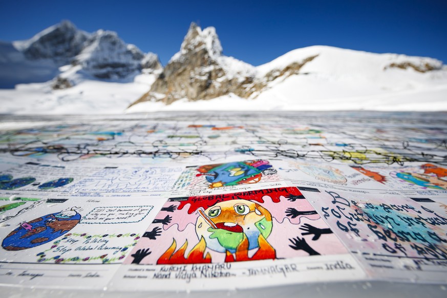 epa07170322 A giant postcard of approximately 2,500 square meters (50x50 meters) and made of contributions from over 125,000 individual postcards containing messages aiming to fight climate change and ...