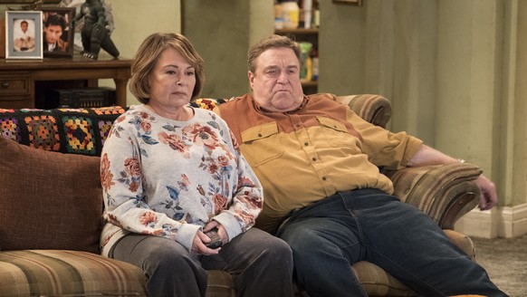 FILE - In this image released by ABC, Roseanne Barr, left, and John Goodman appear in a scene from the reboot of &quot;Roseanne,&quot; premiering on Tuesday at 8 p.m. EST. For the reboot, Roseanne wil ...