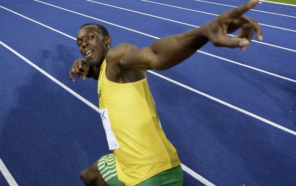 Jamaica&#039;s Usain Bolt celebrates setting a new 100m World Record after the final of the Men&#039;s 100m during the World Athletics Championships in Berlin on Sunday, Aug. 16, 2009. (AP Photo/David ...