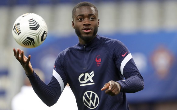 France&#039;s Dayot Upamecano holds a ball during warmup before the UEFA Nations League soccer match between France and Portugal at the Stade de France in Saint-Denis, north of Paris, France, Sunday,  ...