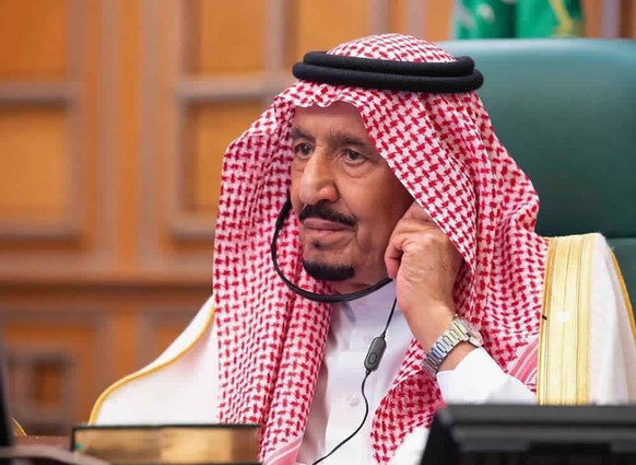 FILE - In this photo released by Saudi Press Agency, SPA, Saudi King Salman, chairs a video call of world leaders from the Group of 20 and other international bodies and organizations, from his office ...
