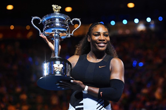 epa05756209 Serena Williams of the USA poses with her trophy after defeating her sister Venus Williams in their women&#039;s final at the Australian Open Grand Slam tennis tournament in Melbourne, Vic ...