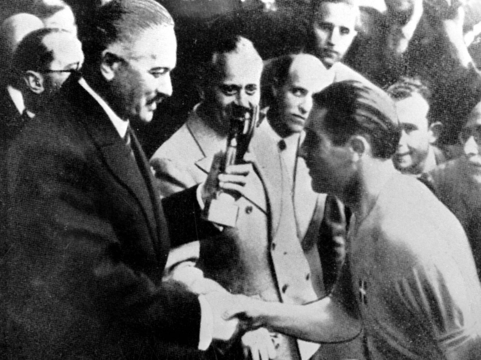 FILE - This is a June 18 1938 file photo Italy soccer team captain Giuseppe Meazza receives the Rimet Cup at the end of the soccer World Cup Final, in Colombes Stadium, Paris, France. Italy defeated H ...