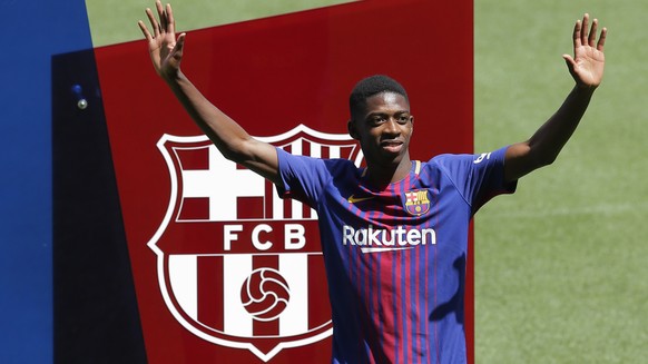 French soccer player Ousmane Dembele gestures during official presentation at the Camp Nou stadium in Barcelona, Spain, Monday, Aug. 28, 2017. Barcelona is shoring up its attack following Neymar&#039; ...