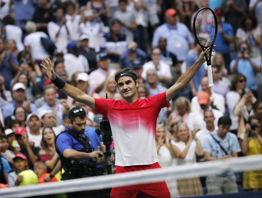 Roger Federer, of Switzerland, reacts after defeating Mikhail Youzhny, of Russia, during the second round of the U.S. Open tennis tournament, Thursday, Aug. 31, 2017, in New York. (AP Photo/Andres Kud ...