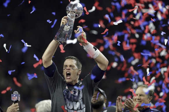 FILE - In this Feb. 5, 2017, file photo, New England Patriots&#039; Tom Brady raises the Vince Lombardi Trophy after defeating the Atlanta Falcons in overtime at the NFL Super Bowl 51 football game in ...