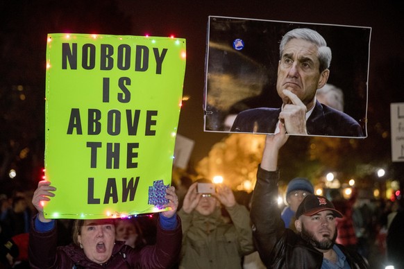 Protesters gather in front of the White House in Washington, Thursday, Nov. 8, 2018, as part of a nationwide &quot;Protect Mueller&quot; campaign demanding that Acting U.S. Attorney General Matthew Wh ...