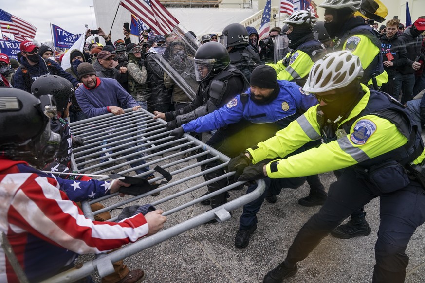 Trump supporters try to break through a police barrier, Wednesday, Jan. 6, 2021, at the Capitol in Washington. As Congress prepares to affirm President-elect Joe Biden&#039;s victory, thousands of peo ...