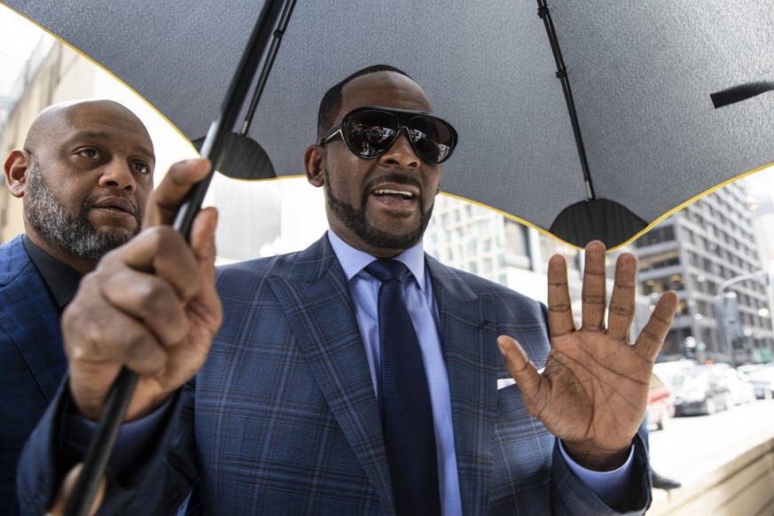 Musician R. Kelly arrives at the Daley Center for a hearing in his child support case at the Daley Center, Wednesday, March 6, 2019, in Chicago. Kelly was charged last month with sexually abusing four ...