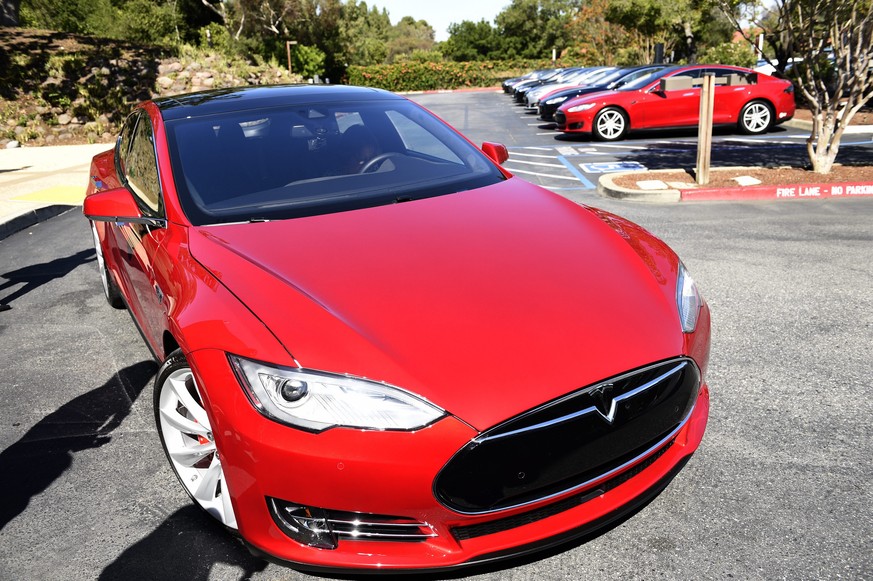 epa05400298 (FILE) A file picture dated 30 April 2015 shows a Tesla Motors Model S on a parking lot of the Tesla Motors Headquarters in Palo Alto, California, USA. The carmaker in a blog post on 30 Ju ...