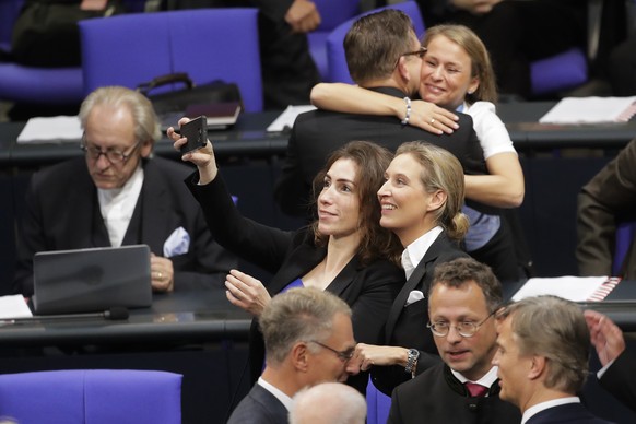 Alice Weidel, center right, parliamentary faction leader of the Alternative for Germany AfD, poses for a photo with a parliament colleague prior to the first meeting of the German parliament after the ...