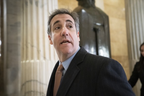 FILE - In this March 6, 2019, file photo, Michael Cohen, President Donald Trump&#039;s former lawyer, returns to Capitol Hill for testimony in Washington. The federal Bureau of Prisons has begun relea ...