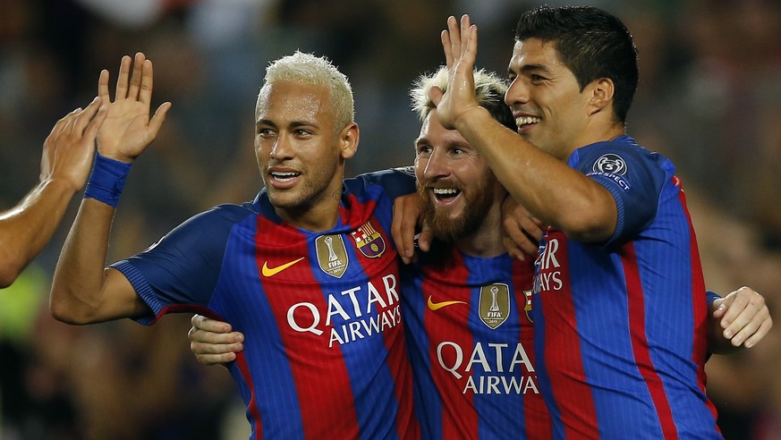 Barcelona&#039;s Lionel Messi, center, celebrates with his teammates Luis Suarez, right, and Neymar after scoring his side&#039;s fifth goal during a Champions League, Group C soccer match between Bar ...