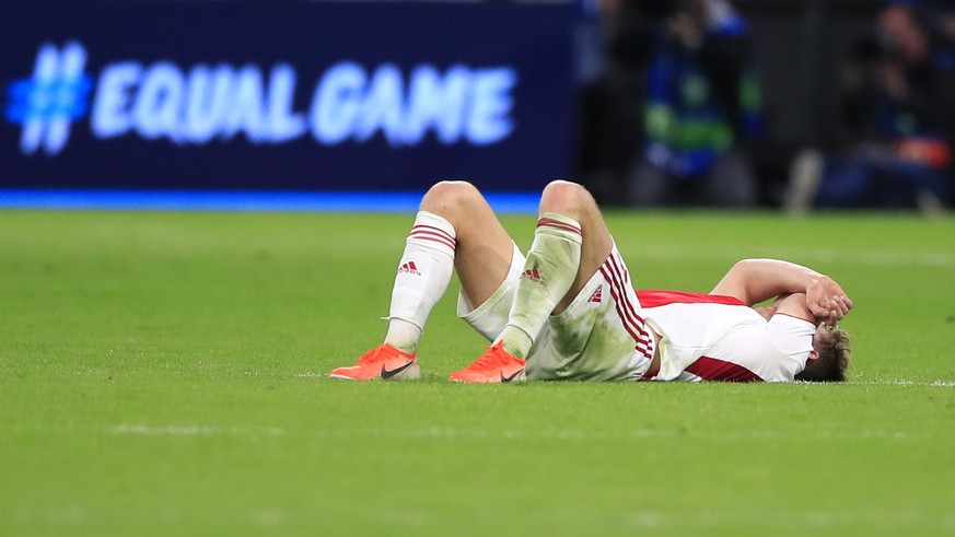 An Ajax player lies on the pitch at the end of the Champions League semifinal second leg soccer match between Ajax and Tottenham Hotspur at the Johan Cruyff ArenA in Amsterdam, Netherlands, Wednesday, ...