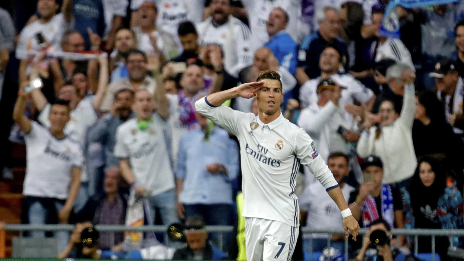 epa05941066 Real Madrid&#039;s Cristiano Ronaldo celebrates scoring the 1-0 opening goal the UEFA Champions League semifinal first leg soccer match between Real Madrid and Atletico Madrid at the Santi ...
