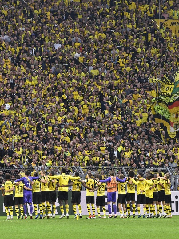 Dortmund&#039;s players celebrate with their fans after winning the German Bundesliga soccer match between Borussia Dortmund and RB Leipzig in Dortmund, Germany, Sunday, Aug. 26, 2018. (AP Photo/Marti ...