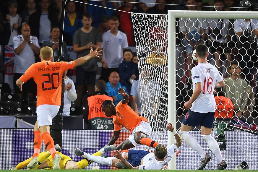 epa07631392 England&#039;s Kyle Walker (bottom C) causes an own goal during the UEFA Nations League semi final soccer match between the Netherlands and England at D. Afonso Henriques stadium in Guimar ...