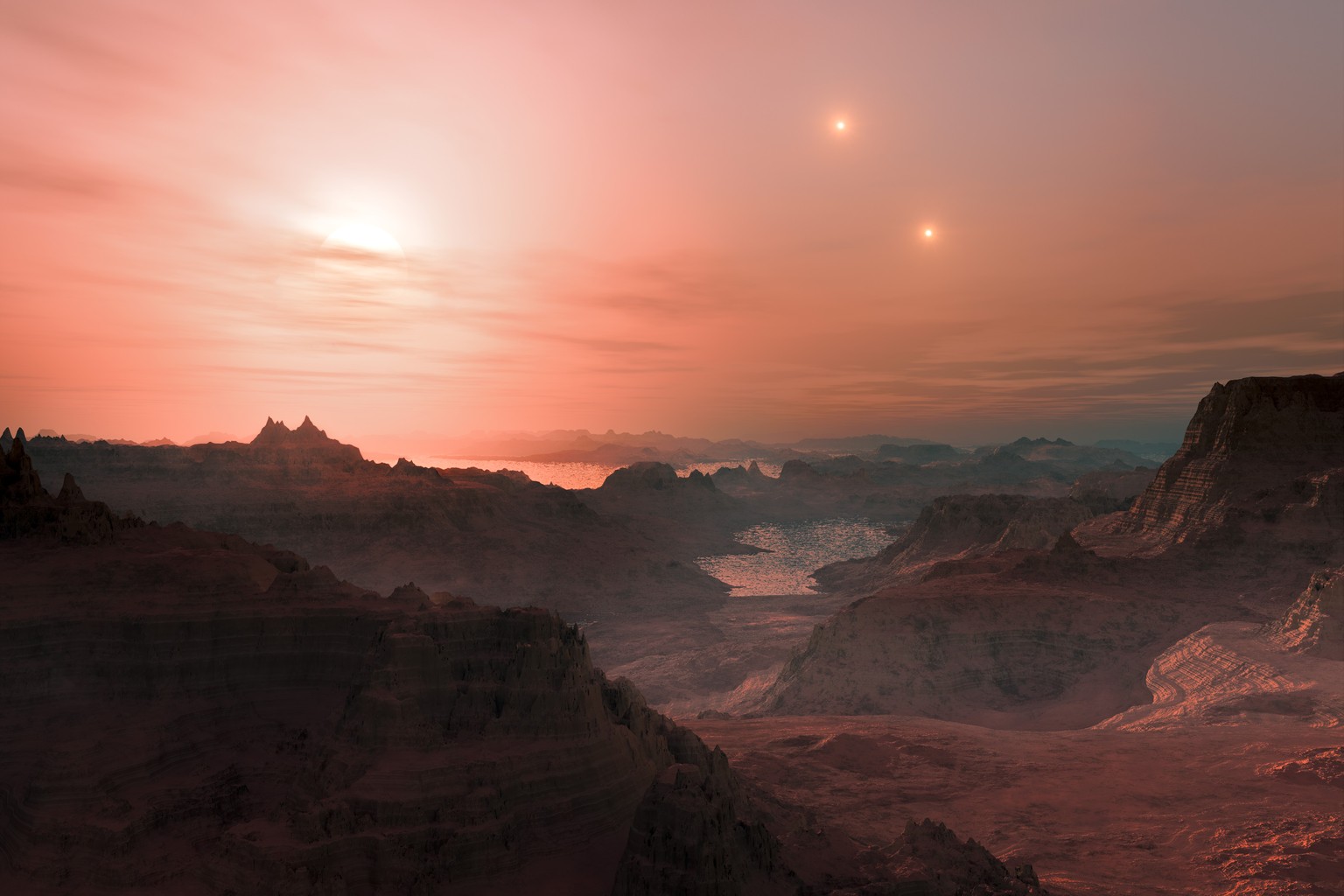 So stellt sich der Künstler einen Sonnenuntergang auf dem Gesteinsplaneten Gliese 667 Cc vor. Am Himmel die drei Sonnen des Gliese-667-Systems: Am hellsten der Rote Zwerg Gliese 667 C (l.), weiter rec ...