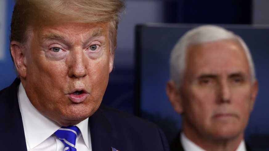 President Donald Trump speaks about the coronavirus in the James Brady Press Briefing Room of the White House, Thursday, April 23, 2020, in Washington, as Vice President Mike Pence listens. (AP Photo/ ...
