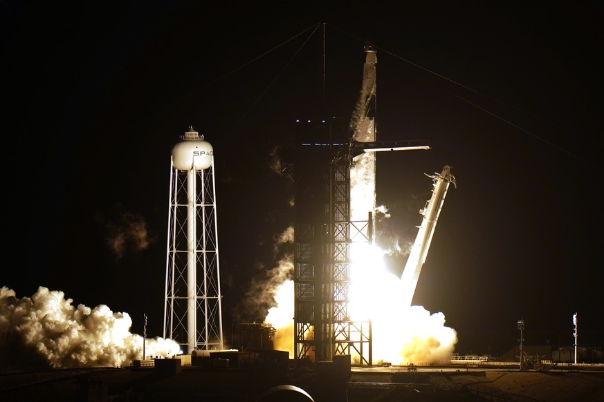 A SpaceX Falcon9 rocket, with the Crew Dragon capsule attached, lift&#039;s off from Kennedy Space Center&#039;s Launch Complex 39-A Sunday Nov. 15, 2020, in Cape Canaveral, Fla. Four astronauts are b ...