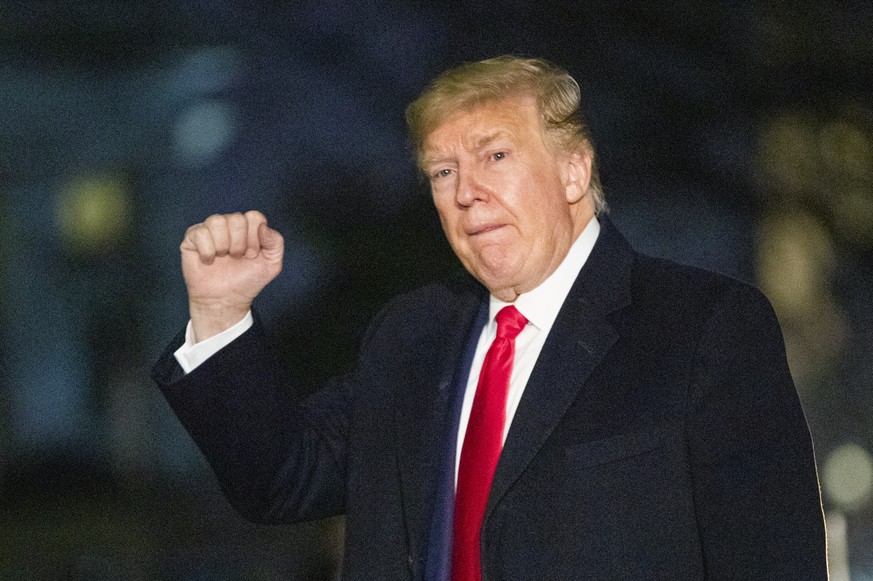 President Donald Trump gestures upon arrival at the White House, Wednesday, Jan. 22, 2020, in Washington, from the World Economic Forum in Davos, Switzerland, (AP Photo/Manuel Balce Ceneta)
Donald Tru ...