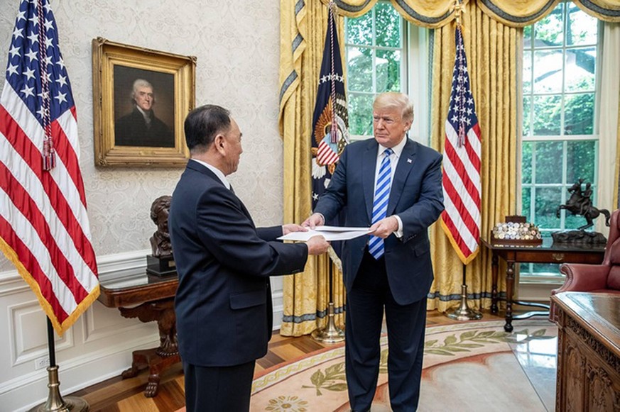President Donald J. Trump is presented with a letter from North Korean leader Kim Jong Un, on June 1, 2018, by North Korean envoy Kim Yong Chol in the Oval Office at the White House in Washington, DC. ...