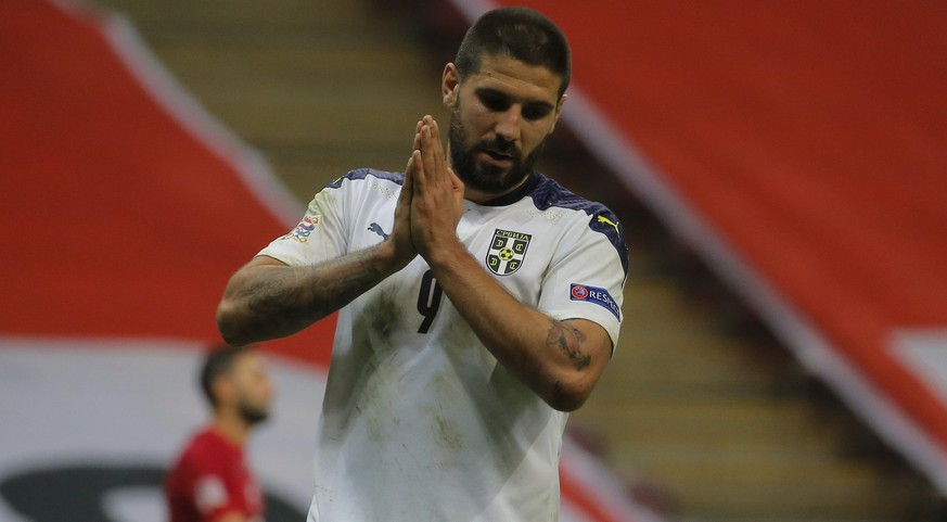 Serbia&#039;s Aleksandar Mitrovic reacts after missing a chance to score during the UEFA Nations League soccer match between Turkey and Serbia in Istanbul Wednesday, Oct. 14, 2020. The match ended 2-2 ...