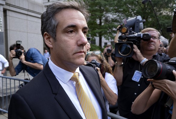 FILE - In this Aug. 21, 2018 file photo, Michael Cohen, former personal lawyer to President Donald Trump, leaves federal court after reaching a plea agreement in New York. Investigators in New York st ...