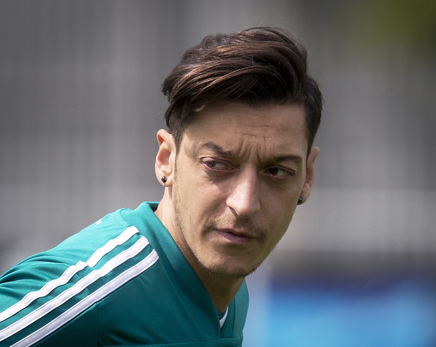FILE-In this June 14 file photo Mesut Oezil looks around during a training session of the German team at the 2018 soccer World Cup in Vatutinki near Moscow, Russia, Thursday, June 14, 2018. (AP Photo/ ...