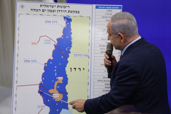 epa07832844 Israeli Prime Minister Benjamin Netanyahu shows a map of the Jordan Valley as he delivers a statement in Ramat Gan near Tel Aviv, Israel, 10 September 2019. Netanyahu has stated its intent ...
