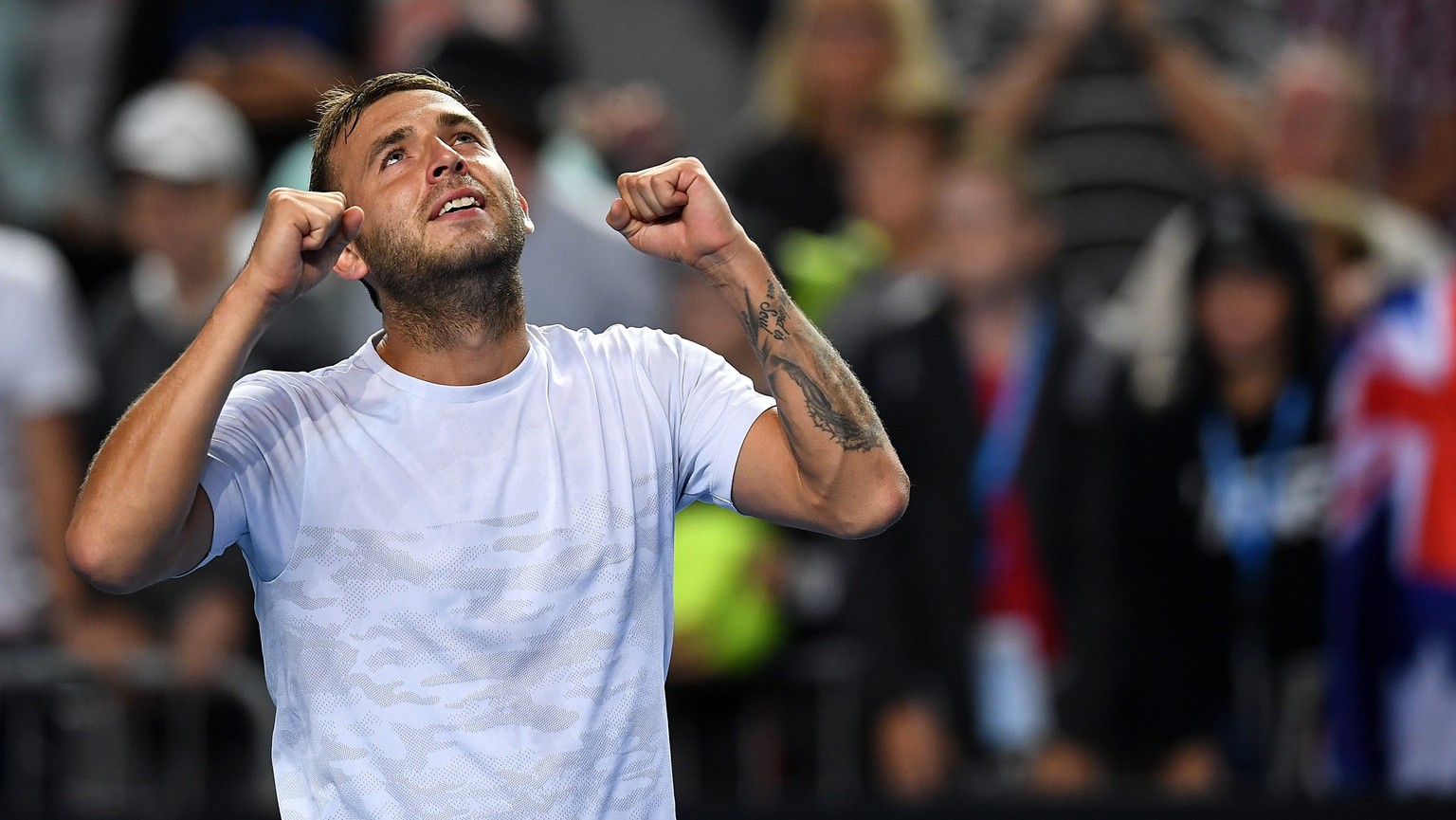 epa05733724 Daniel Evans of Great Britain celebrates winning against Bernard Tomic of Australia at the end of their Men&#039;s Singles third round match for the Australian Open tennis tournament, in M ...