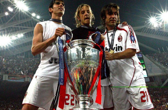 epa01017745 AC Milan players (from left) Kaka, Massimo Ambrosini and Andrea Pirlo celebrate after the team won the UEFA Champions League final at the Olympic stadium in Athens, Greece, 23 May 2007. EP ...