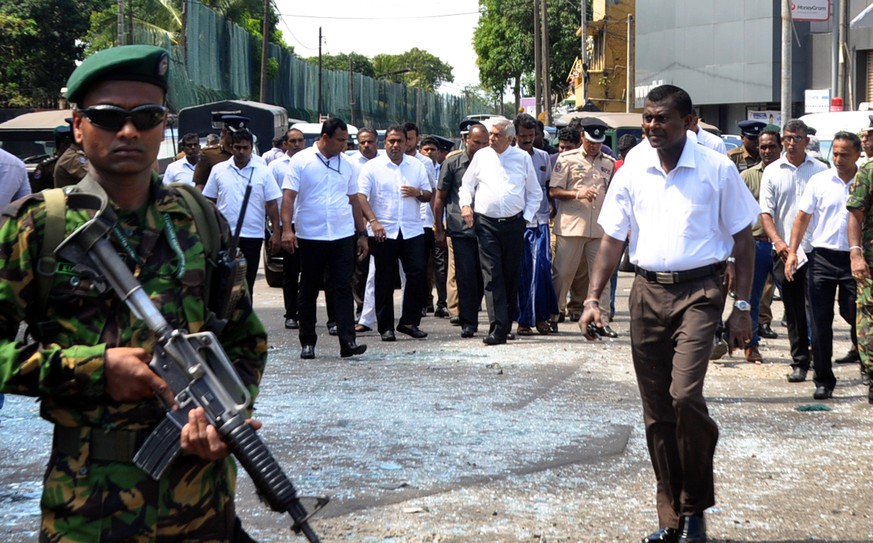 epa07519595 Sri Lankan prime minister Ranil Wickremesinghe (C-R) arrives at the scene after an explosion hit at St Anthony&#039;s Church in Kochchikade in Colombo, Sri Lanka, 21 April 2019. According  ...