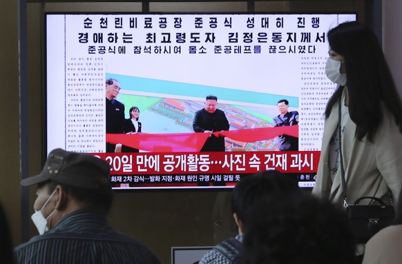People watch a TV showing an image of North Korean leader Kim Jong Un during a news program at the Seoul Railway Station in Seoul, South Korea, Saturday, May 2, 2020. Kim made his first public appeara ...