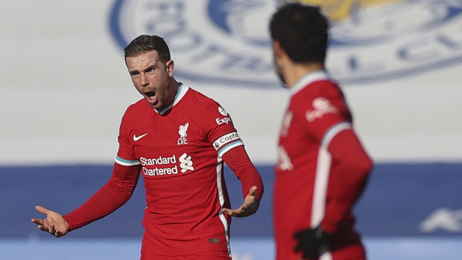 Liverpool&#039;s Jordan Henderson, left, shouts out during the English Premier League soccer match between Leicester City and Liverpool at the King Power Stadium in Leicester, England, Saturday, Feb.  ...