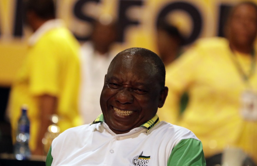 The newly elected African National Congress (ANC) President, Cyril Ramaphosa, reacts after it was announced that he had won the vote at the ANC&#039;s elective conference in Johannesburg, Monday Dec.  ...