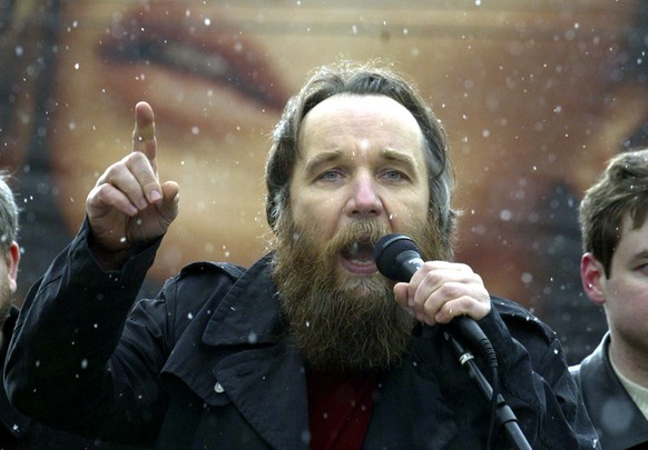 Alexander Dugin, the leader of the Eurasian Movement, speaks during a rally of Russian nationalist groups in central Moscow, Sunday, April 8, 2007, with a billboard in the background. Several hundred  ...