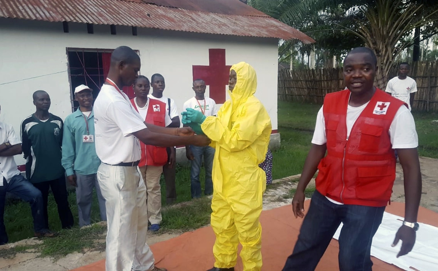 In this photo taken Monday, May 14, 2018, members of a Red Cross team don protective clothing before heading out to look for suspected victims of Ebola, in Mbandaka, Congo. Congo&#039;s Ebola outbreak ...