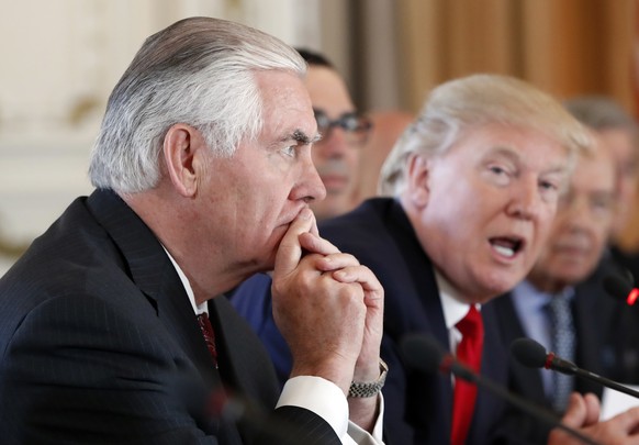 FILE - In this April 7, 2017, file photo Secretary of State Rex Tillerson, left, listens as President Donald Trump speaks during a bilateral meeting with Chinese President Xi Jinping at Mar-a-Lago in  ...