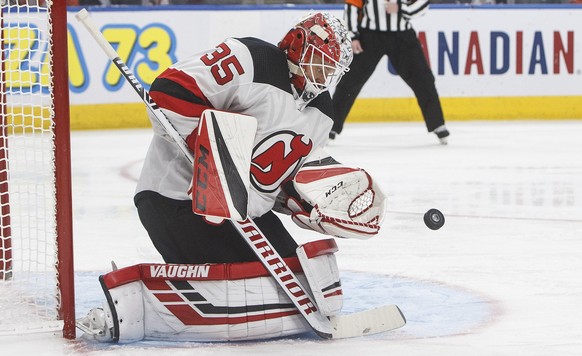 New Jersey Devils&#039; goalie Cory Schneider (35) makes a save during the second period of an NHL hockey game against the New Jersey Devils on Friday, Nov. 8, 2019, in Edmonton, Alberta. (Jason Frans ...