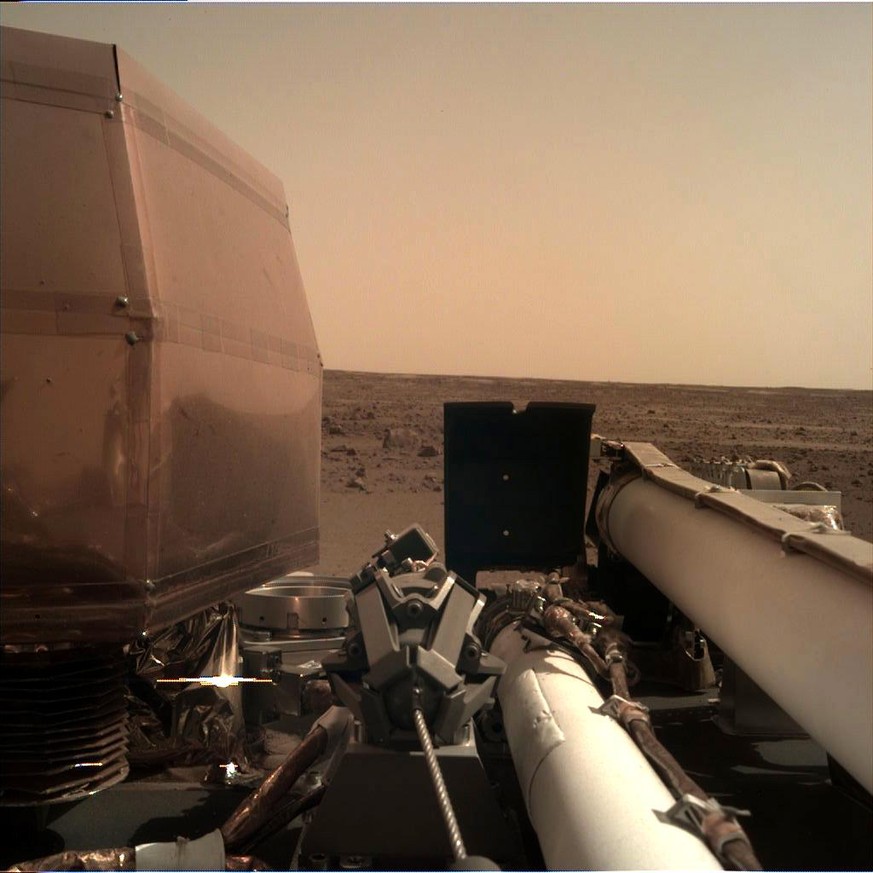 epa07192379 A handout photo made available by NASA late 26 November 2018, made with the Instrument Deployment Camera (IDC), located on the robotic arm of NASA&#039;s InSight lander, that took this pic ...
