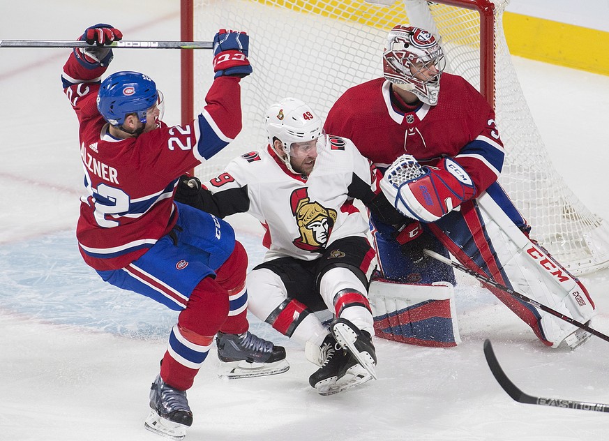Ottawa Senators left wing Christopher DiDomenico (49) is sandwiched between Montreal Canadiens goaltender Carey Price (31) and defenseman Karl Alzner (22) during first-period NHL hockey game action in ...