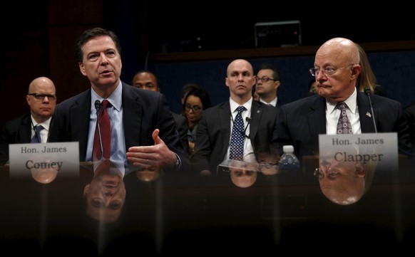 FBI Director James Comey (L) and Director of National Intelligence James Clapper (R) testify in a House Appropriations hearing on &quot;World Wide Threats&quot; on Capitol Hill in Washington February  ...