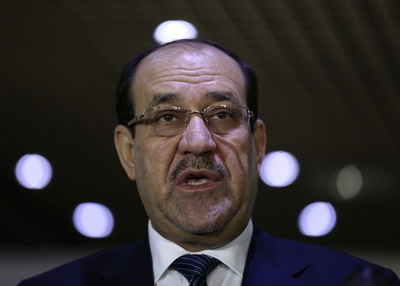Iraqi Prime Minister Nuri al-Maliki speaks during a news conference after a meeting with speaker of parliament Salim al-Jabouri in Baghdad July 26, 2014. Gunmen in army uniforms have seized a senior l ...