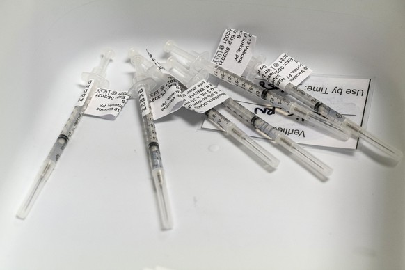Syringes filled with doses of the Pfizer-BioNTech Covid-19 vaccine at a large scale vaccination site in Sacramento, California, U.S., on Thursday, Feb. 4, 2021. California reported 10,501 new cases We ...