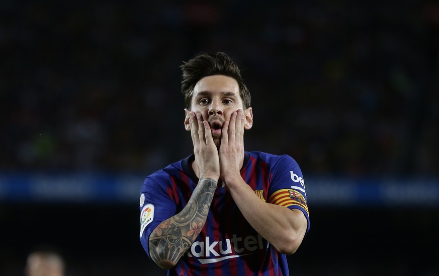 FC Barcelona&#039;s Lionel Messi reacts after missing an opportunity during the Spanish La Liga soccer match between FC Barcelona and Girona at the Camp Nou stadium in Barcelona, Spain, Sunday, Sept.  ...