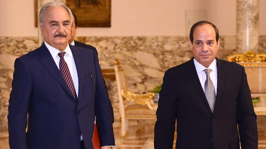 epa07506120 A handout photo made available by Egyptian Presidency shows Egyptian President Abdel Fattah al-Sisi (R) receiving Commander of the Libyan National Army (LNA) Khalifa Haftar (L), in Cairo,  ...